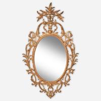 A rare Chippendale oval carved and gilded pine looking glass Probably English, circa 1760-1780