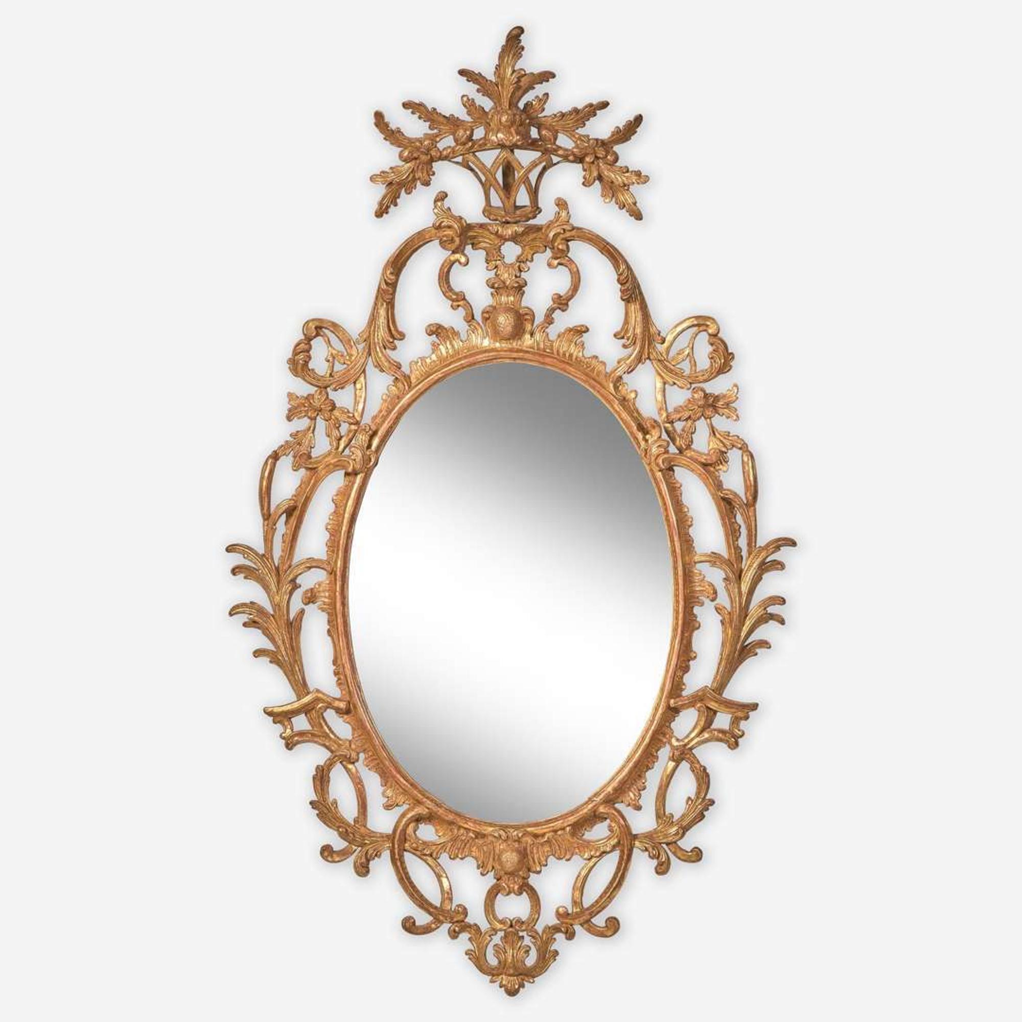 A rare Chippendale oval carved and gilded pine looking glass Probably English, circa 1760-1780