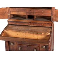 A Classical Figured Maple and Mahogany Desk-and-Bookcase