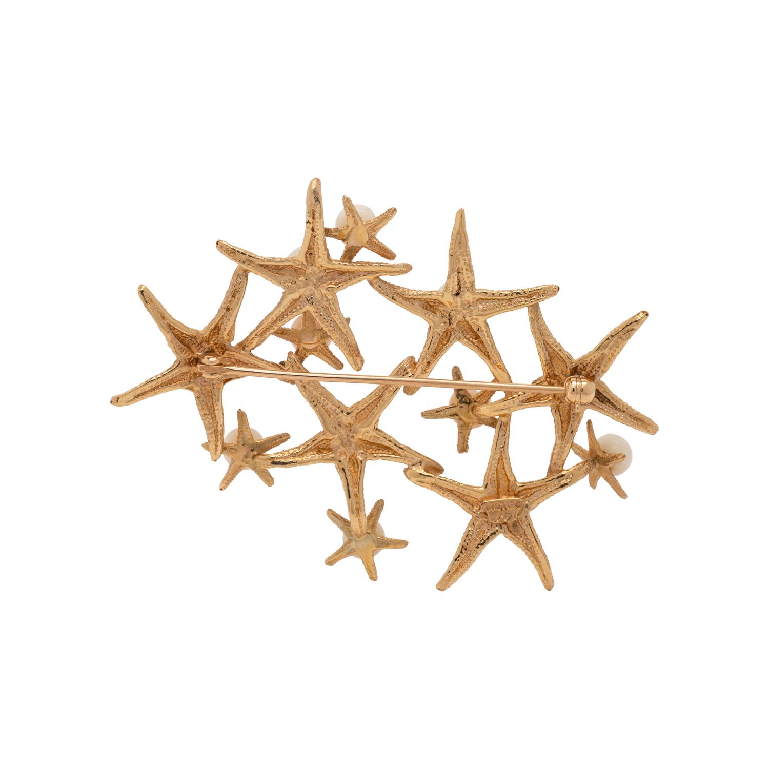 CELLINO, YELLOW GOLD AND CORAL STARFISH BROOCH