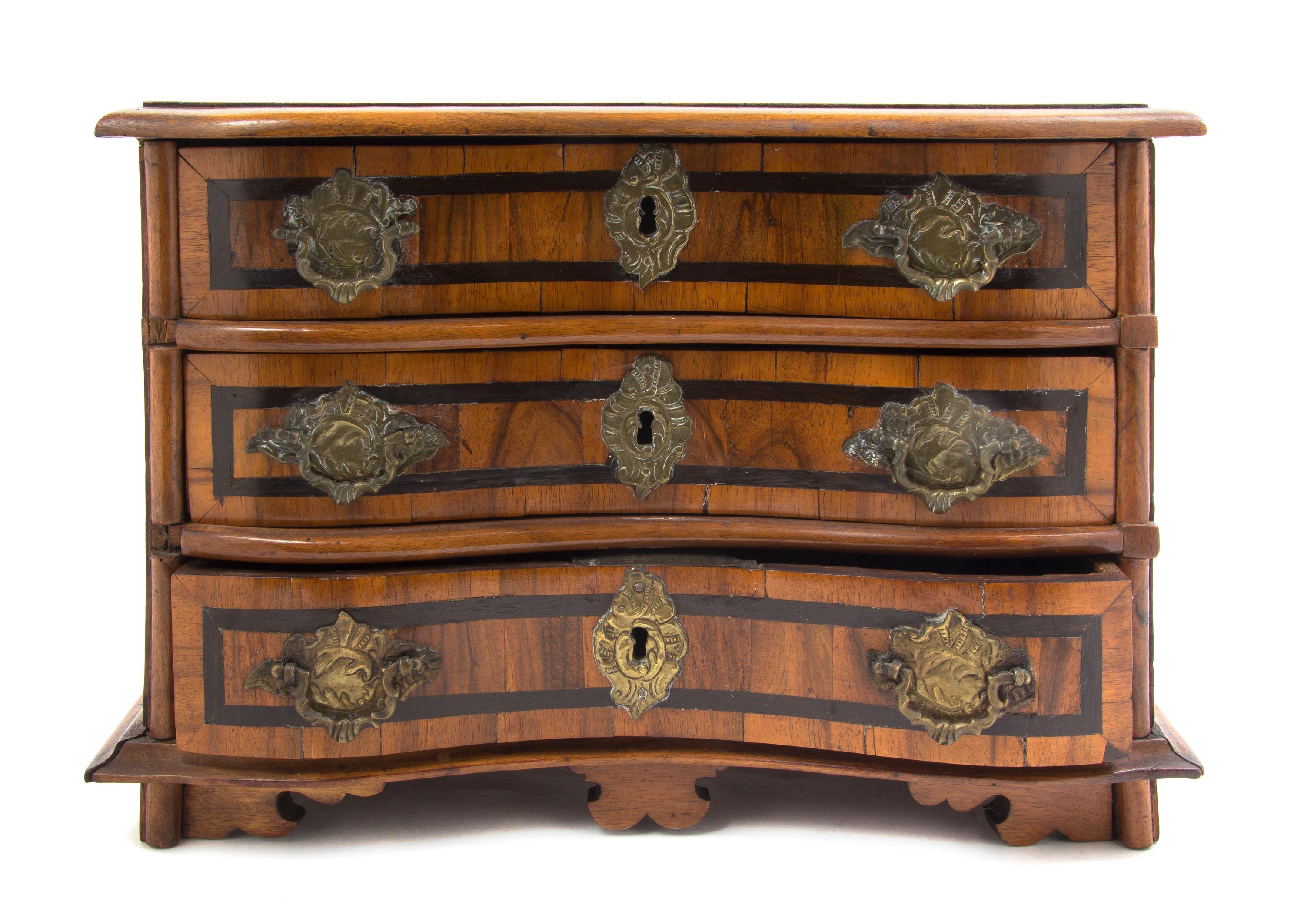 A Continental Fruitwood Diminutive Chest of Drawers, Height 9 1/2 x width 13 1/2 x depth 7 1/4 inches.
