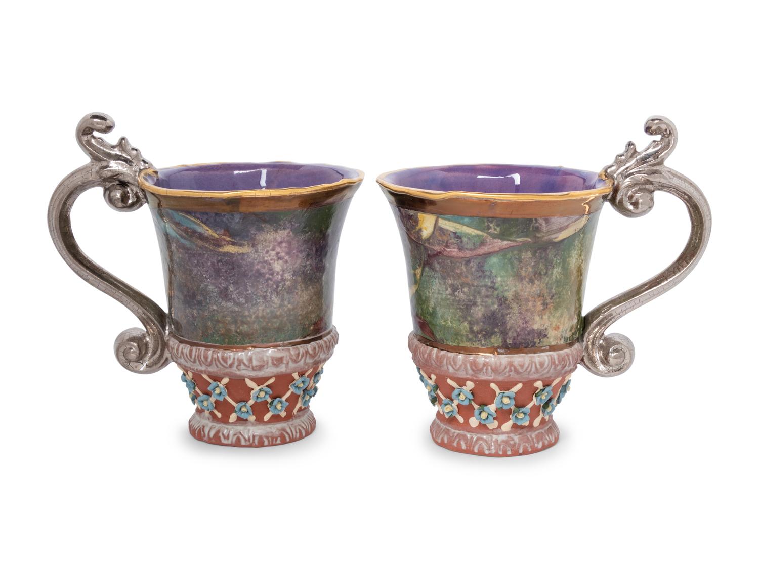 A Set of Fourteen MacKenzie-Childs Evervolving Ceramic Mugs