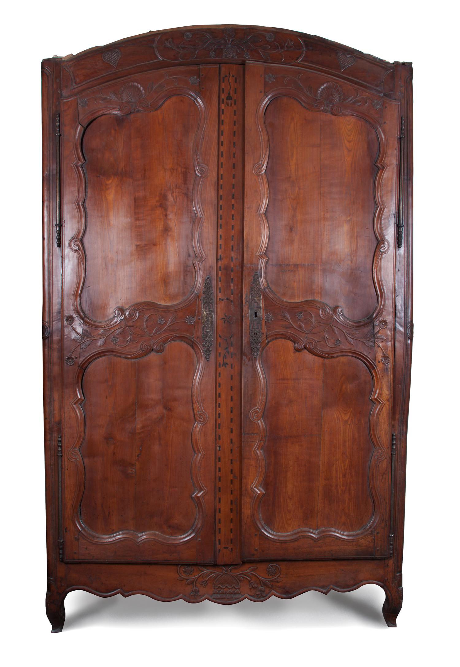 A French Provincial Relief Carved Walnut Armoire Height 88 x width 57 1/2 x depth 18 inches.