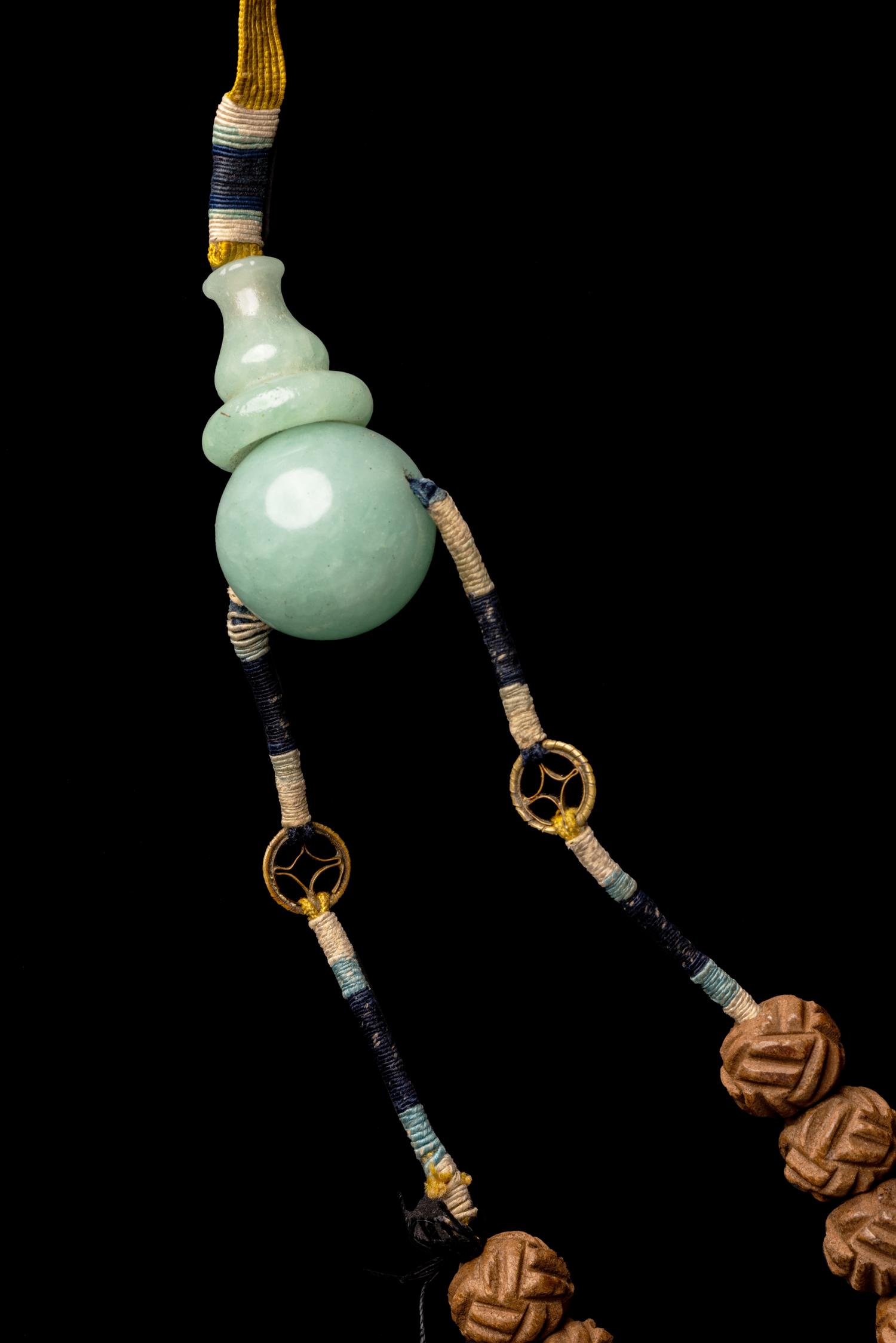 A Chinese Carved Seed Court Necklace, Chaozhu