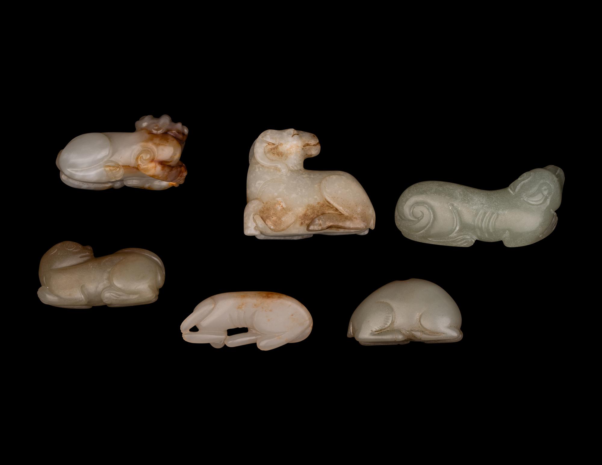 Six Chinese Carved Celadon Jade Figures of Recumbent Animals
