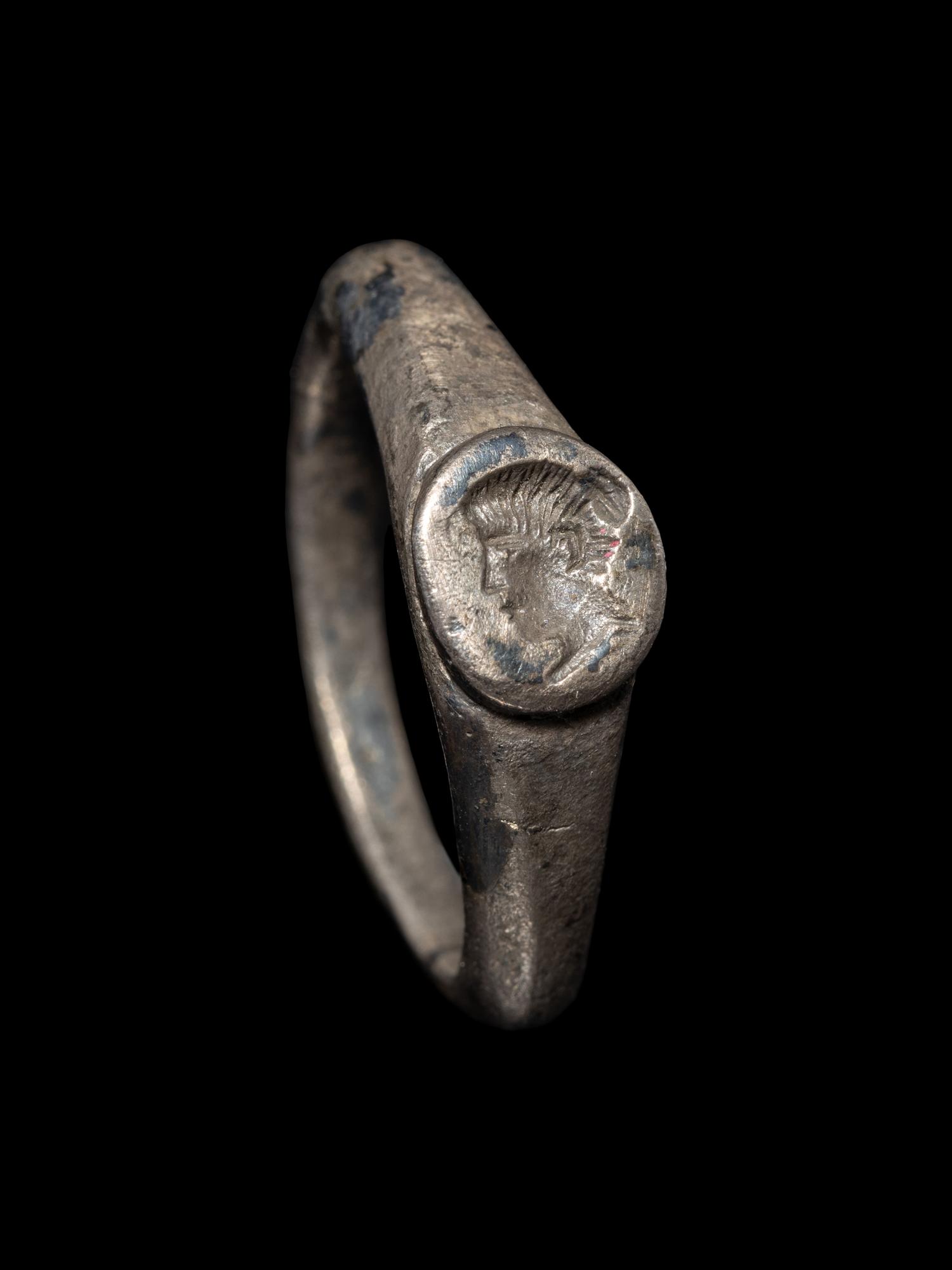 A Roman Silver Finger Ring with a Portrait Bust of a Woman