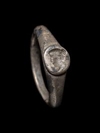 A Roman Silver Finger Ring with a Portrait Bust of a Woman