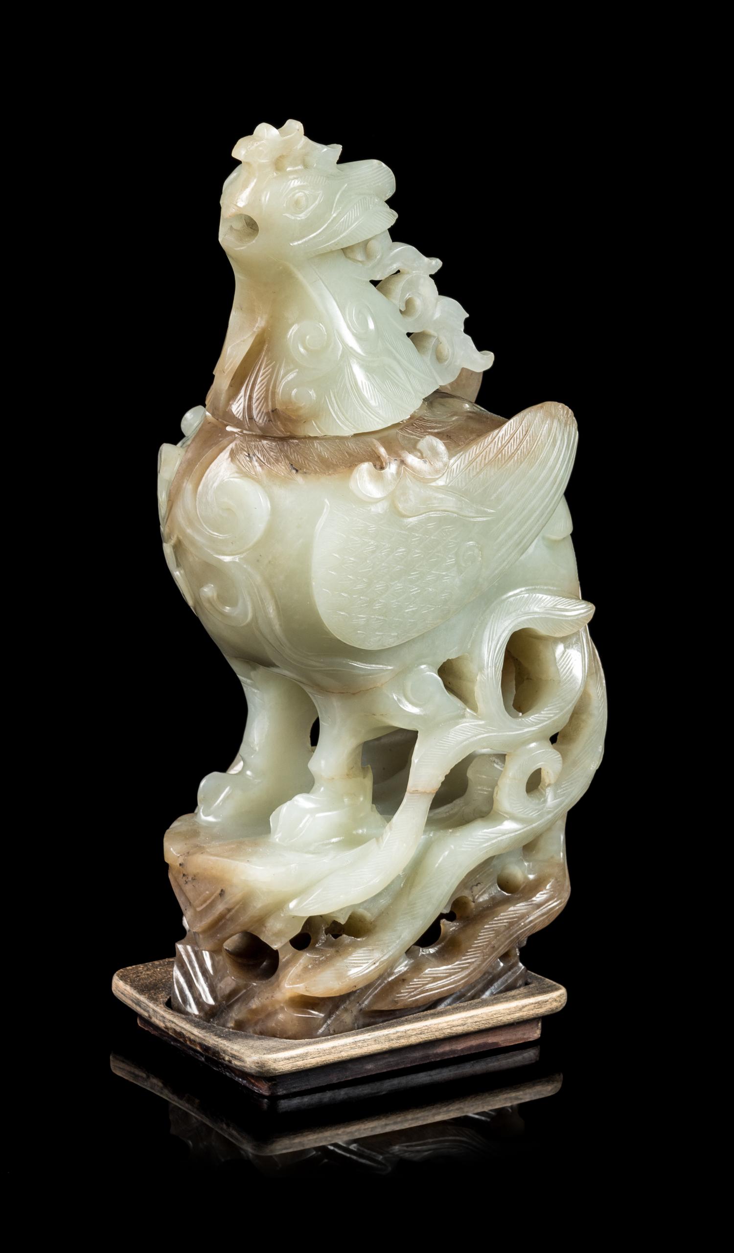 A Russet and Celadon Jade Phoenix-Form Covered Vessel Height 8 1/2 inches. — 20TH CENTURY