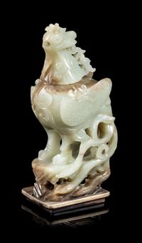 A Russet and Celadon Jade Phoenix-Form Covered Vessel Height 8 1/2 inches. — 20TH CENTURY