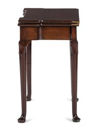 A George III Mahogany Games Table and a Set of Four Queen Anne Style Walnut Dining Chairs