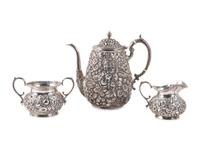 A Repousse Silver Three-Piece Tea Service