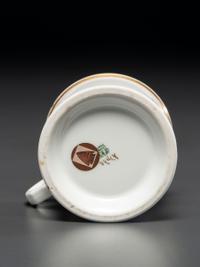 A Porcelain Shaving Mug Depicting a Woman Riding an Ice Velocipede
