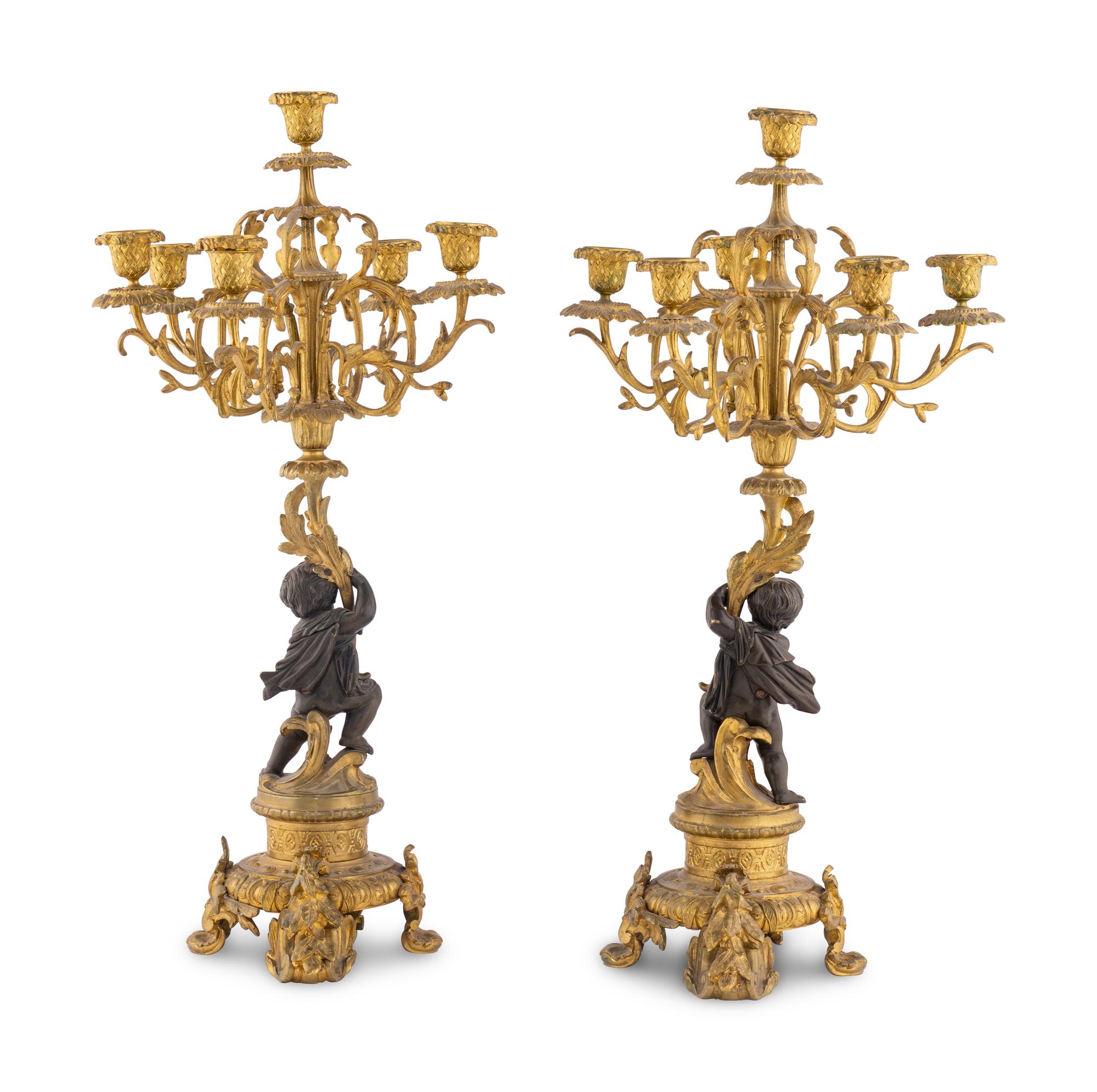 A Pair of French Gilt and Patinated Bronze Six-Light Candelabra