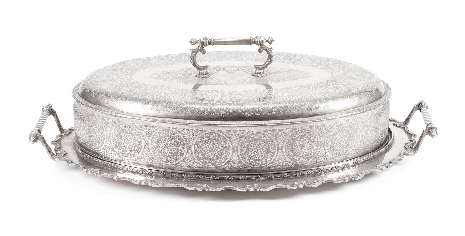 A Silver-Plate Cloche and Tray, Late 19th/Early 20th Century, of oval form, the cloche having a continuous band of circular cartouches