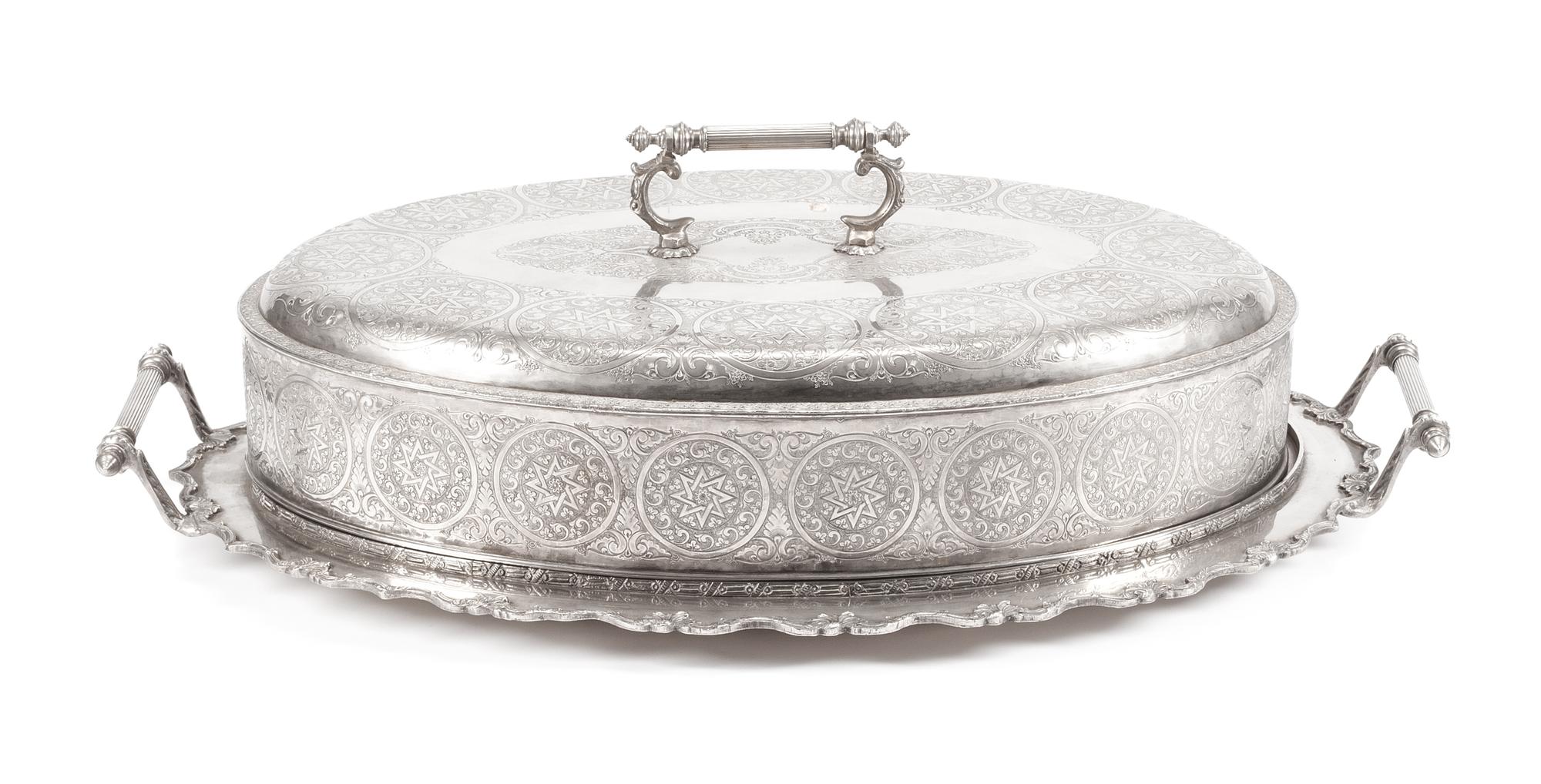A Silver-Plate Cloche and Tray, Late 19th/Early 20th Century, of oval form, the cloche having a continuous band of circular cartouches