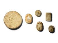 Five Egyptian Faience Seals and an Egyptian Faience Flower Rosette Inlay