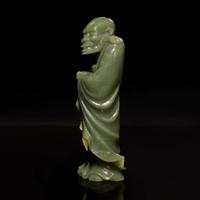 A Chinese carved celadon jade figure of a Lohan 青玉雕羅漢