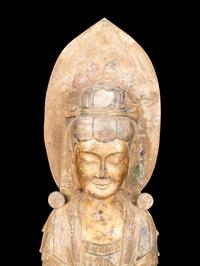 A Chinese Carved Stone Guanyin with Lotus Crown and Remnants of Gilt