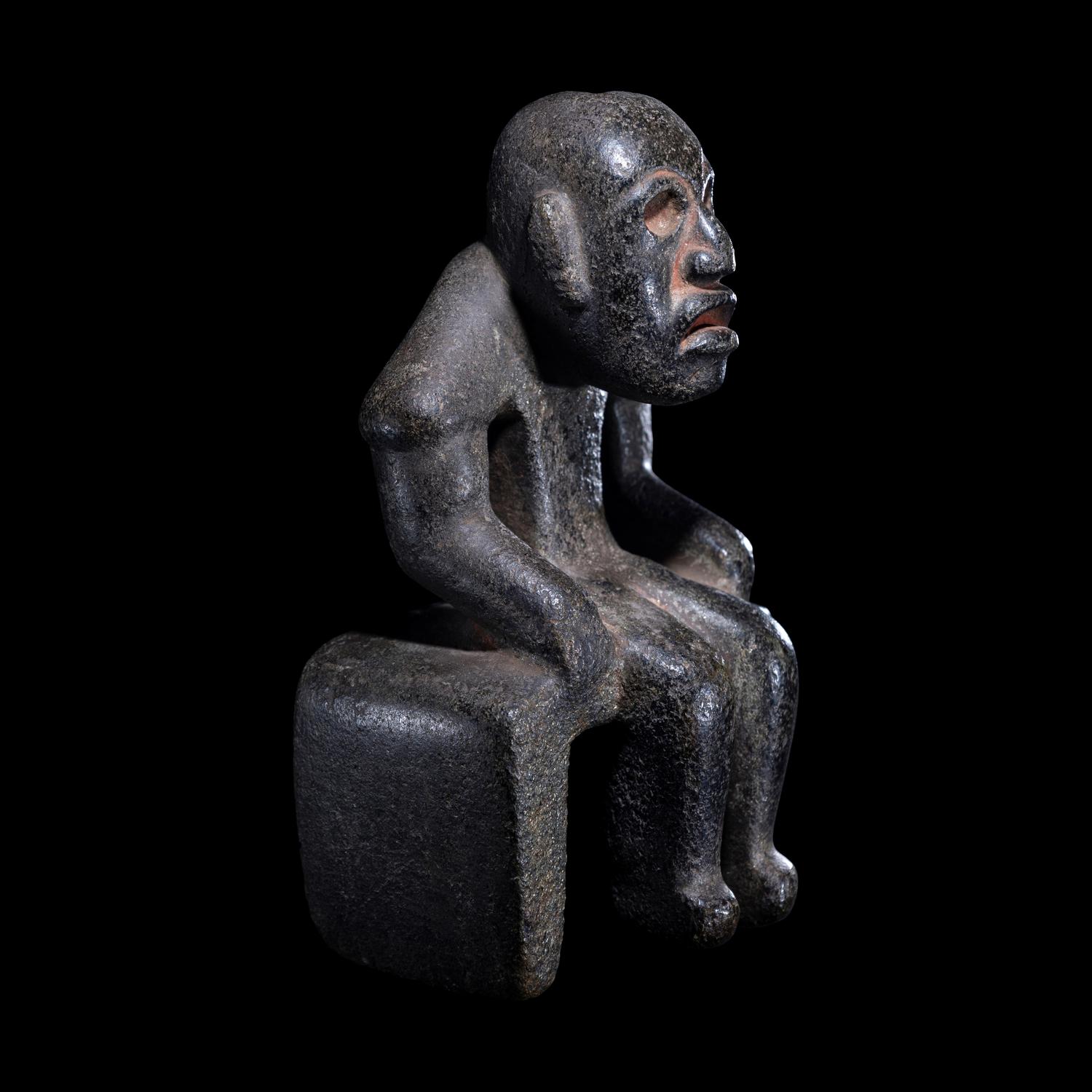 An Olmec Serpentine Seated Figure