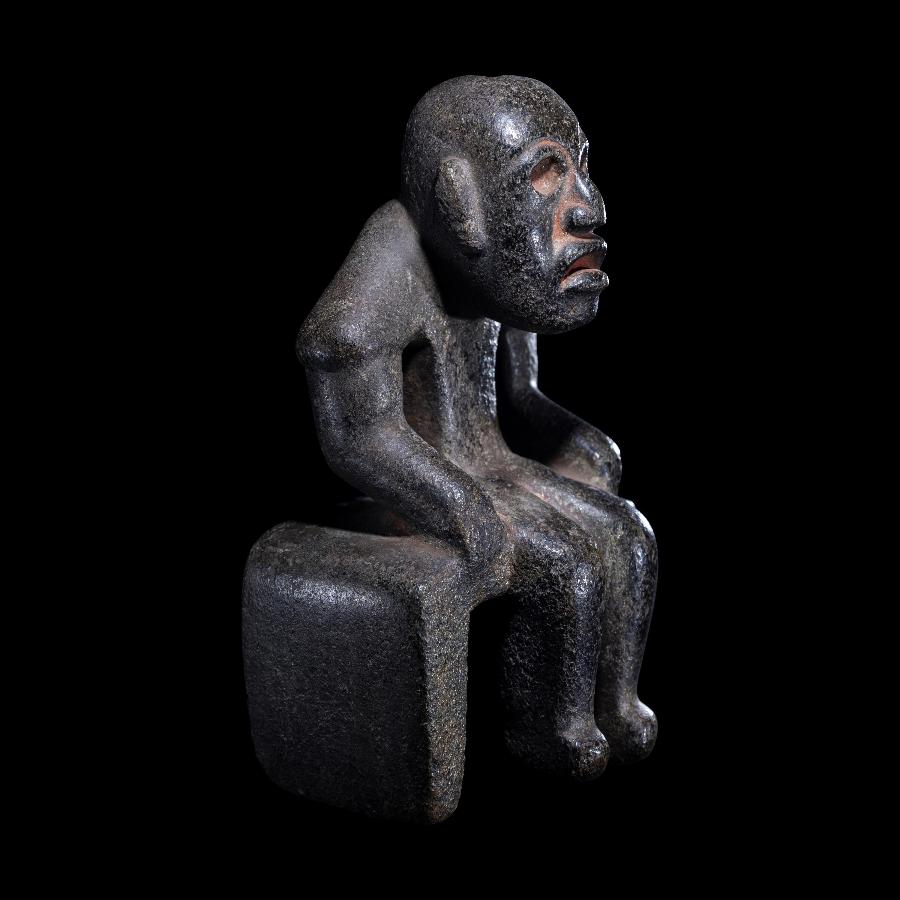 An Olmec Serpentine Seated Figure