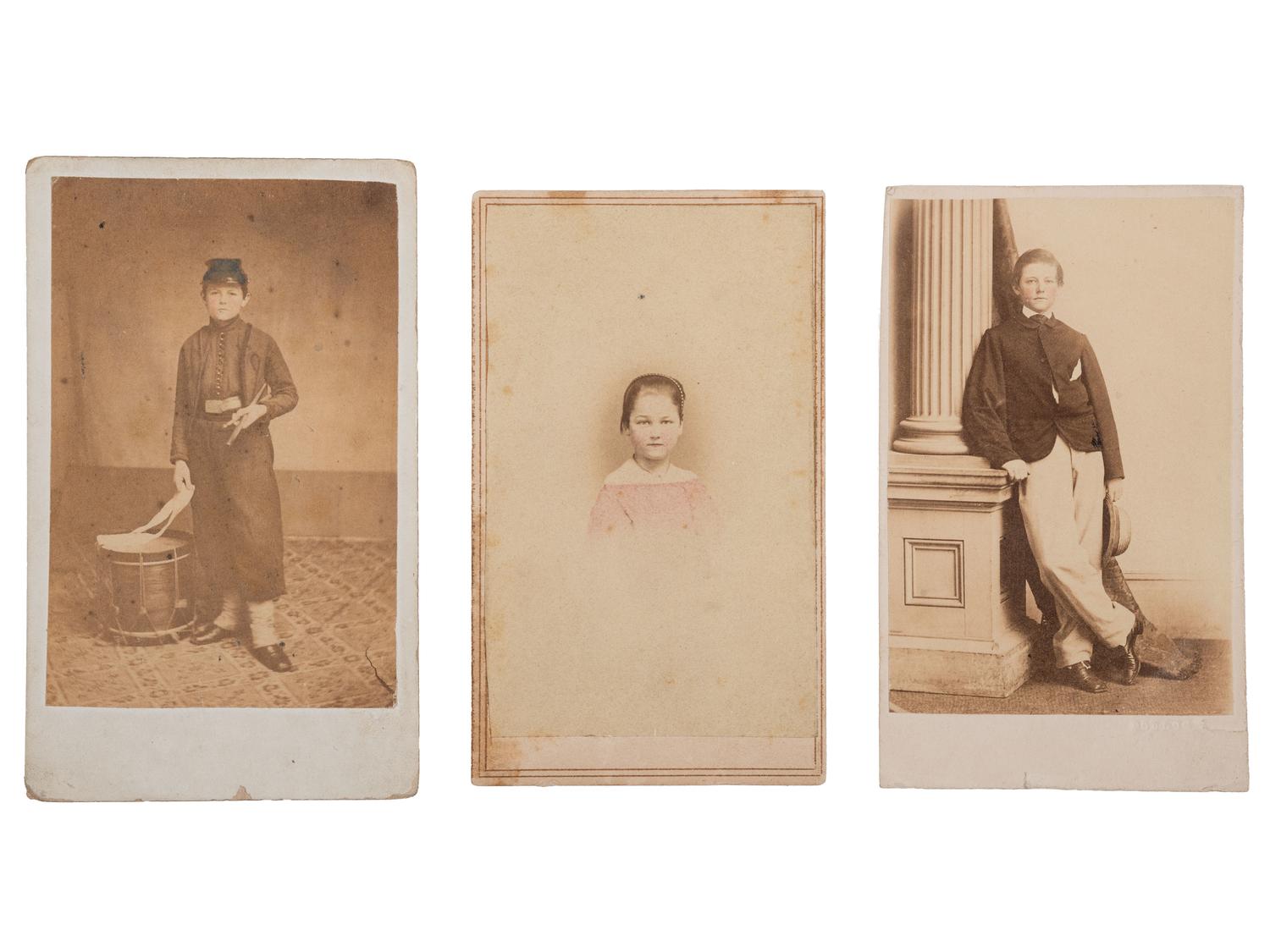 [CIVIL WAR]. A group of 3 CDVs highlighted by 2 portraits of a Union drummer boy displayed under a mat decorated with a hand-drawn patriotic motif.