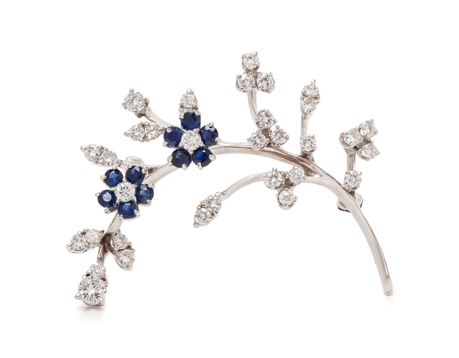 A 14 Karat White Gold, Diamond and Sapphire Flower Motif Brooch,