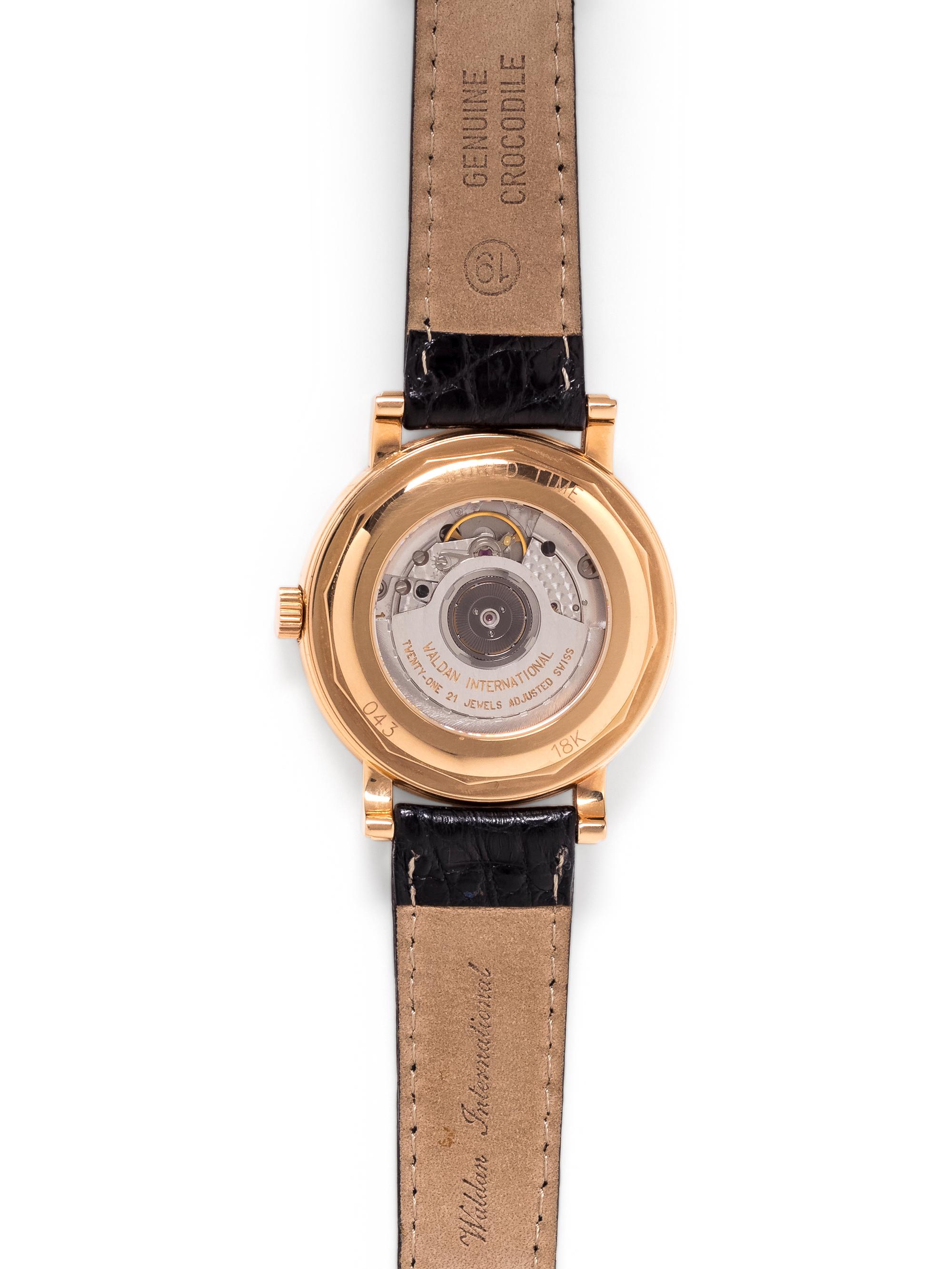WALDAN INTERNATIONAL, 18K YELLOW GOLD 'WORLD TIME' WRISTWATCH