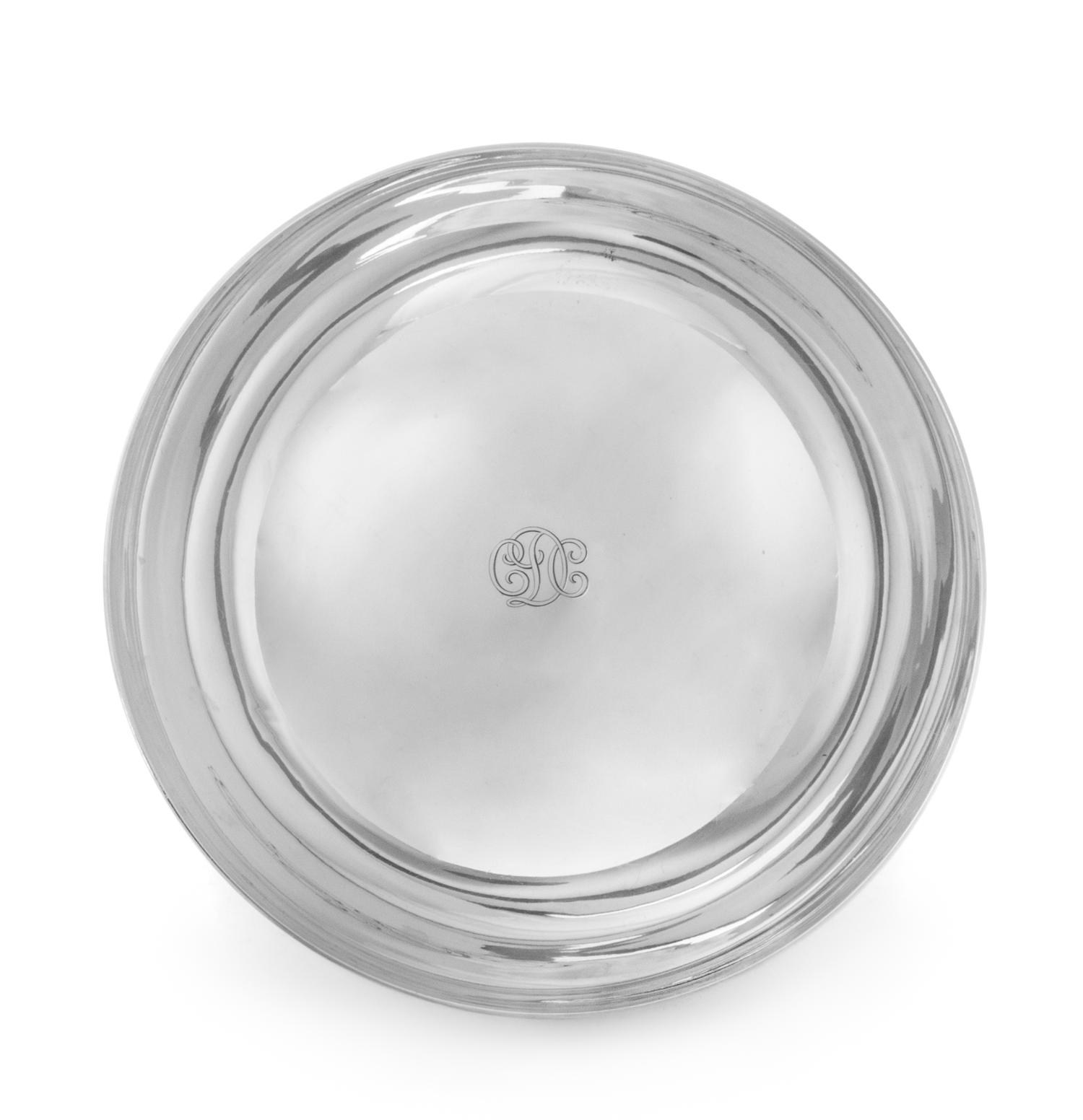 An American Silver Center Bowl, Tiffany & Co., New York, NY, the bowl centered with engraved monogram CDC, raised on a circular foot.