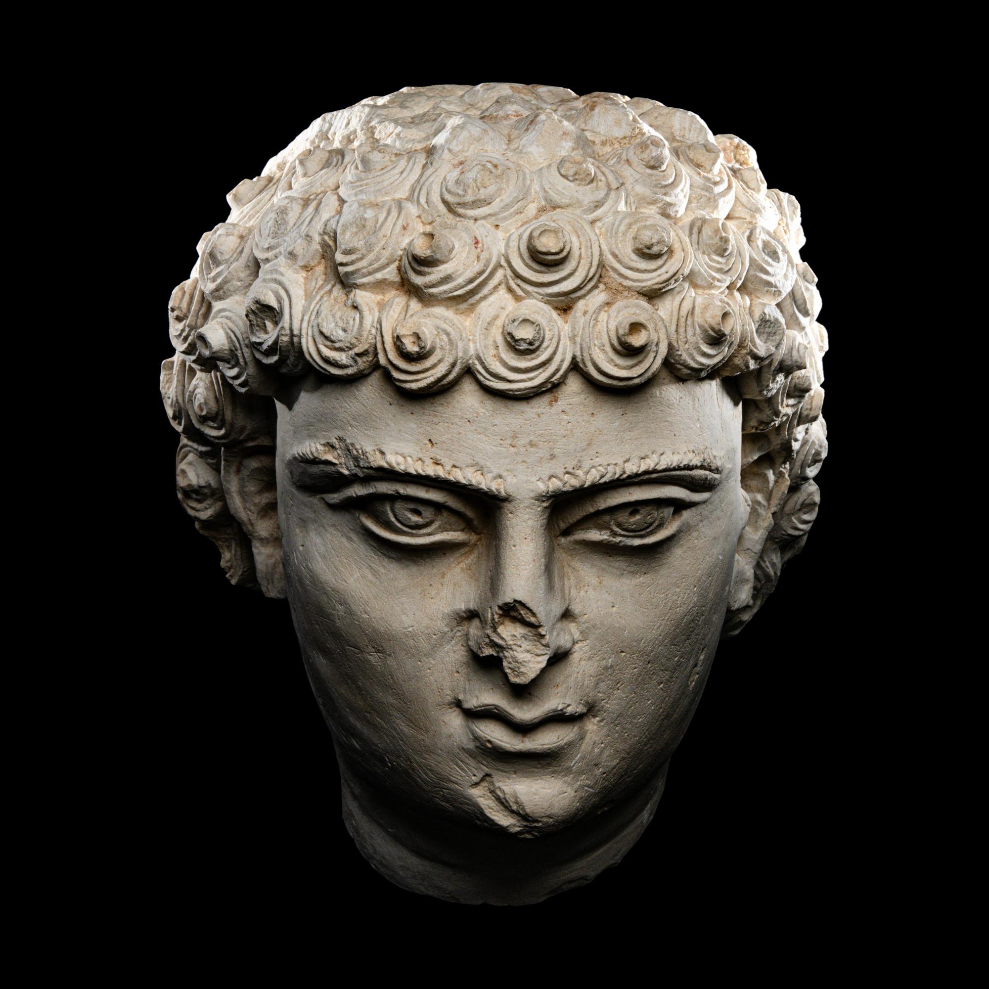 A Palmyrene Limestone Head of a Youth