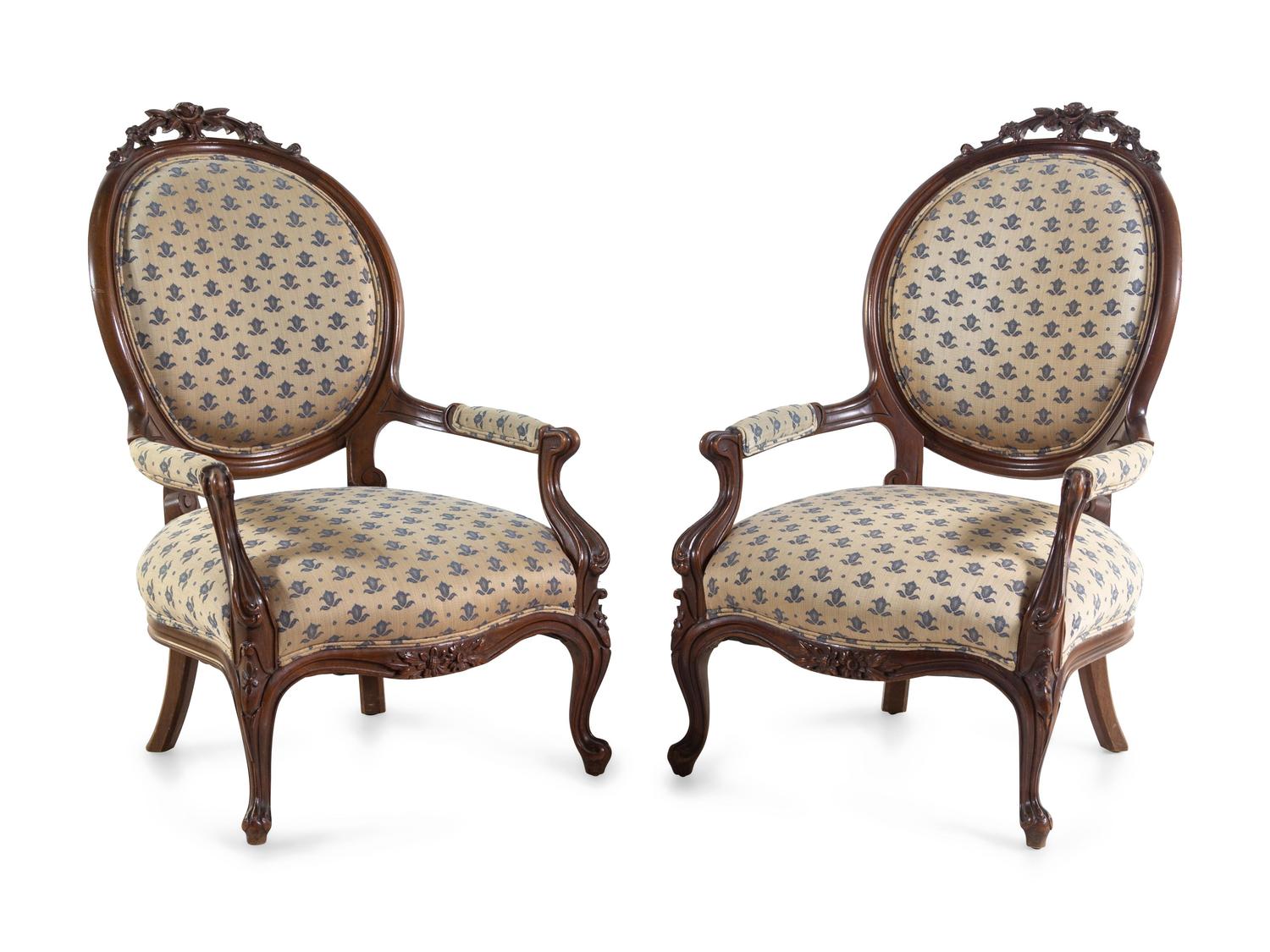 A Pair of Rococo Revival Carved Mahogany Fauteuils