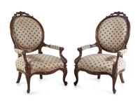 A Pair of Rococo Revival Carved Mahogany Fauteuils