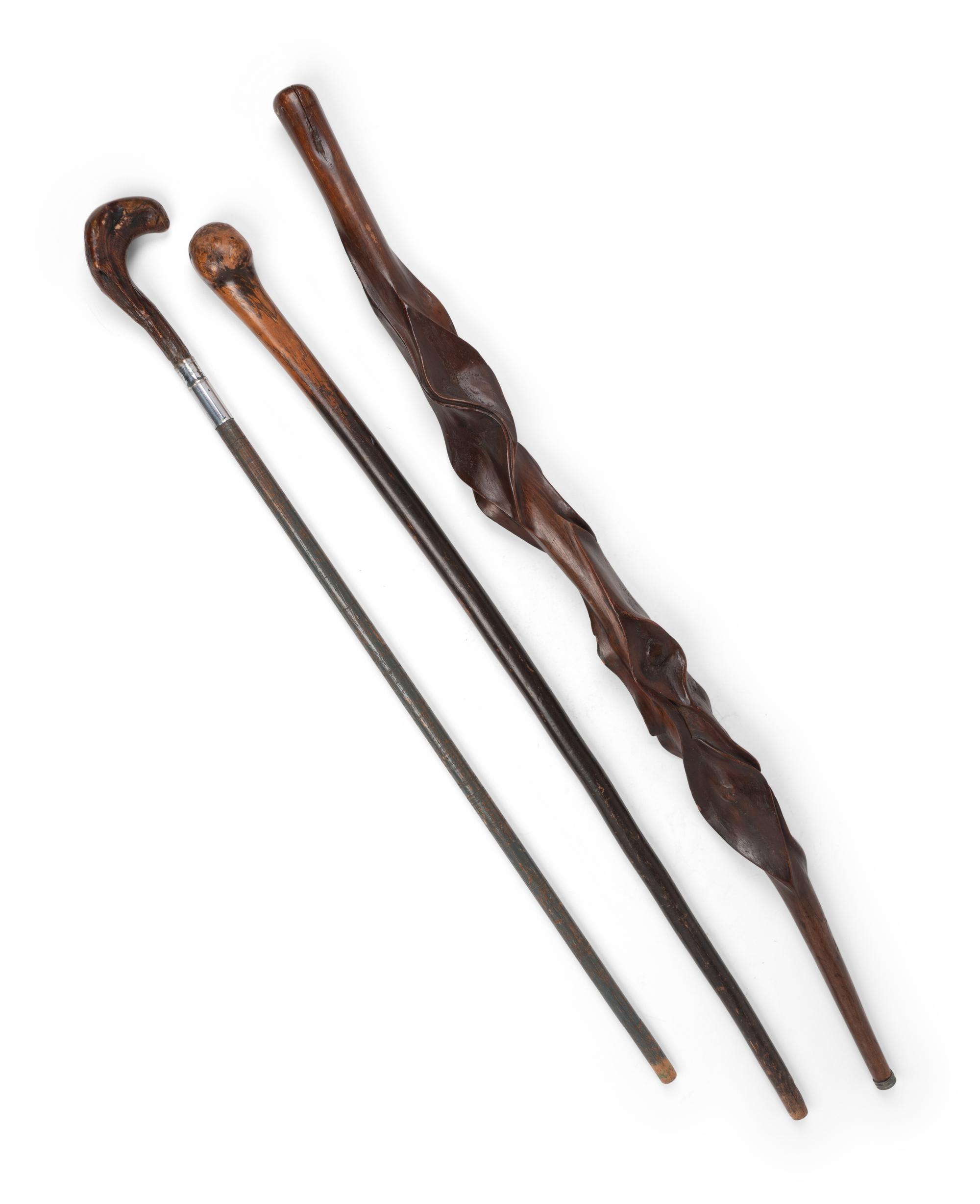 Three Carved Walnut Walking Sticks