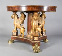 An Empire Style Mahogany Center Table, Height 32 1/2 x diameter 40 inches.