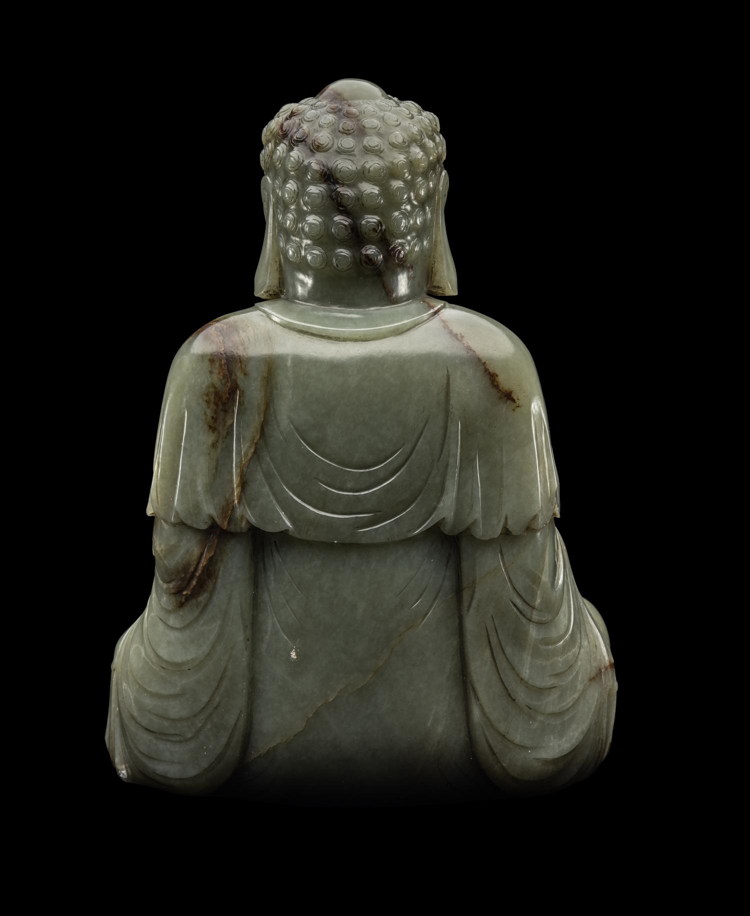 A Chinese Celadon Jade Figure of Medicine Buddha