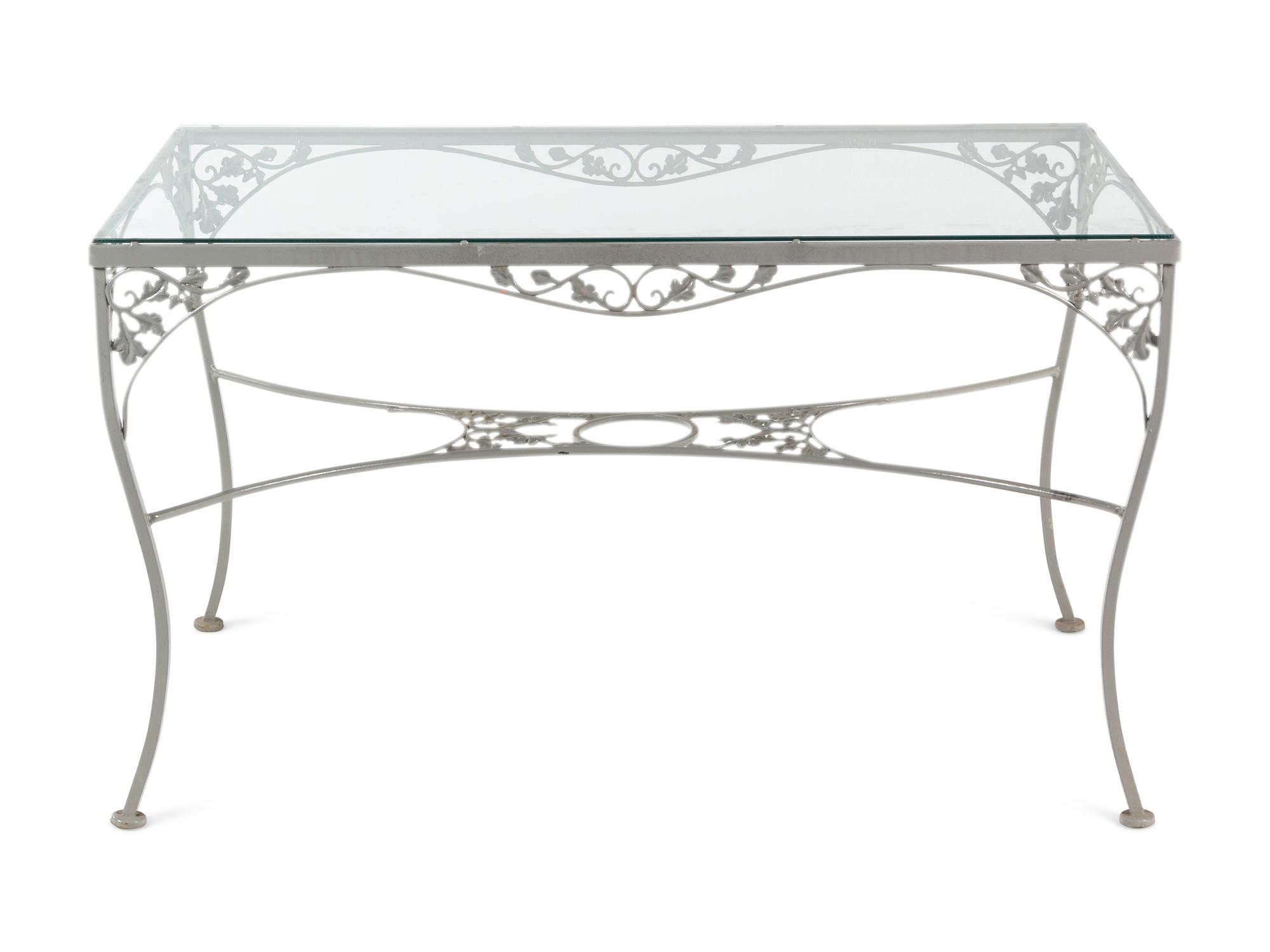 A Woodard "Orleans" Style Painted Iron Garden Table and Four Chairs