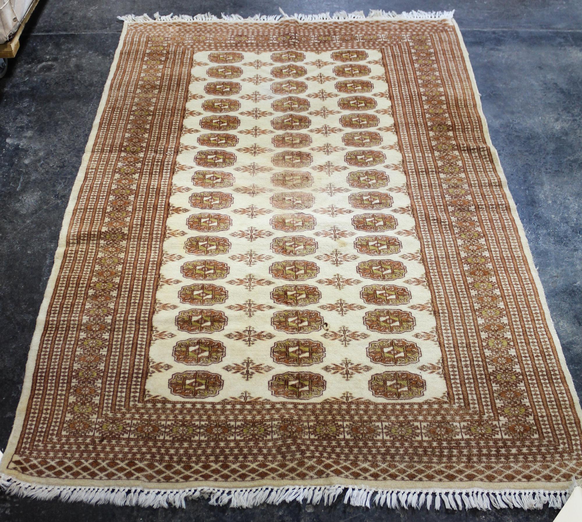 A Bokhara Wool Rug 6 feet 2 inches x 4 feet 2 inches. — SECOND HALF 20TH CENTURY