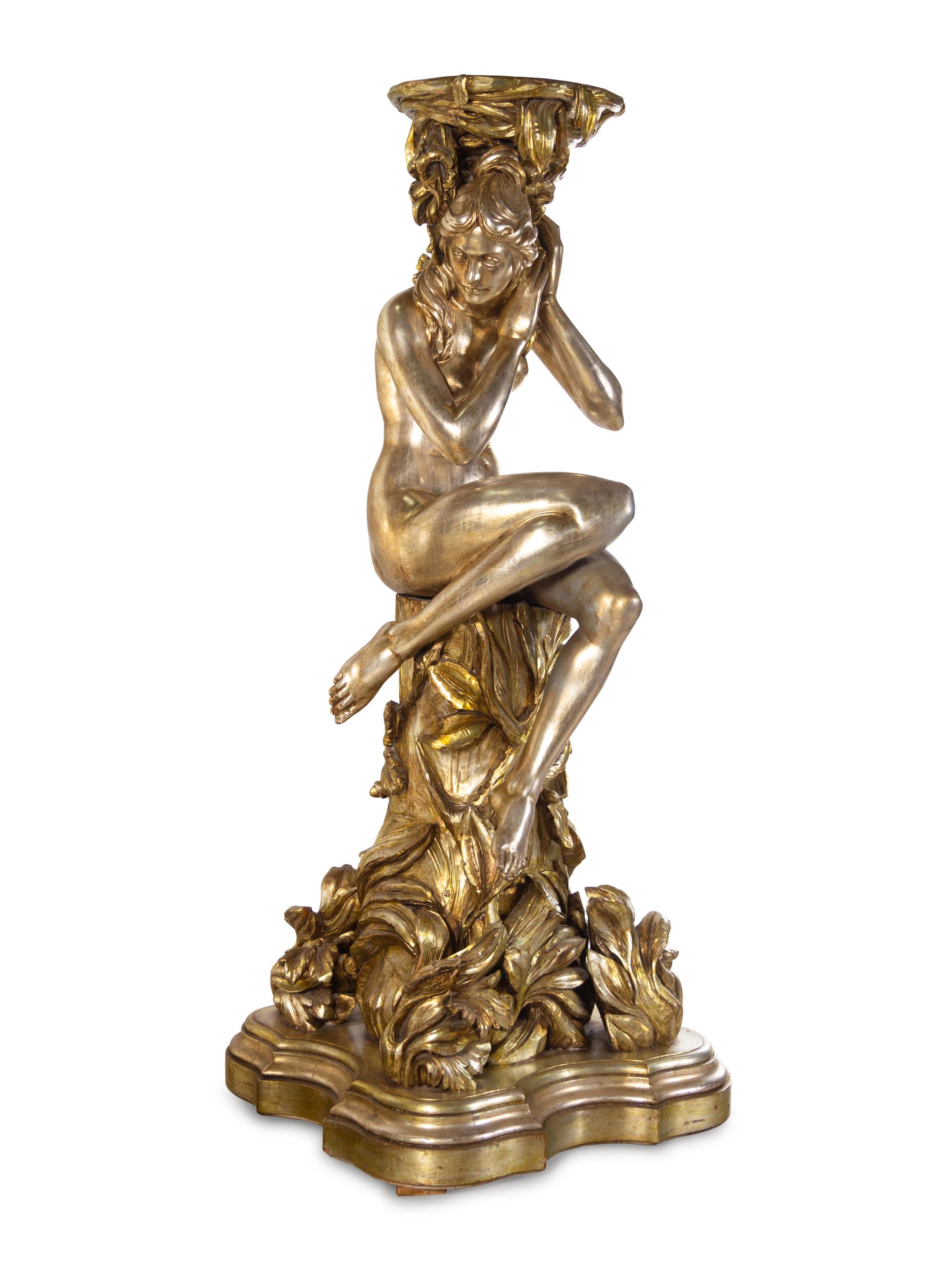 A Pair of Monumental Italian Baroque Style Gilt and Silvered Composition Figural Pedestals