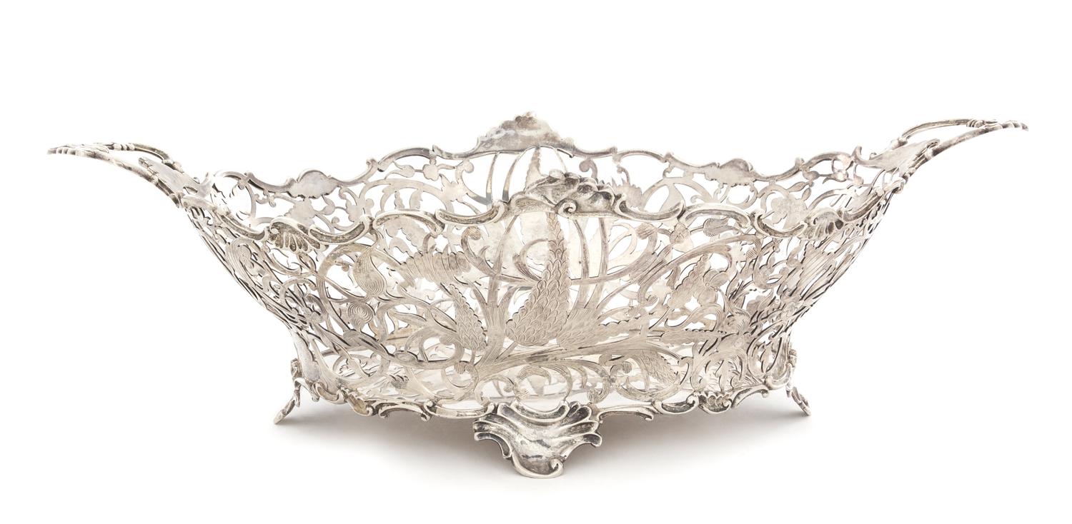 A Dutch Silver Center Basket, Likely Gerrit Duyzer, The Hague, Early 19th Century, the openwork body having floral, foliate and C-scrol