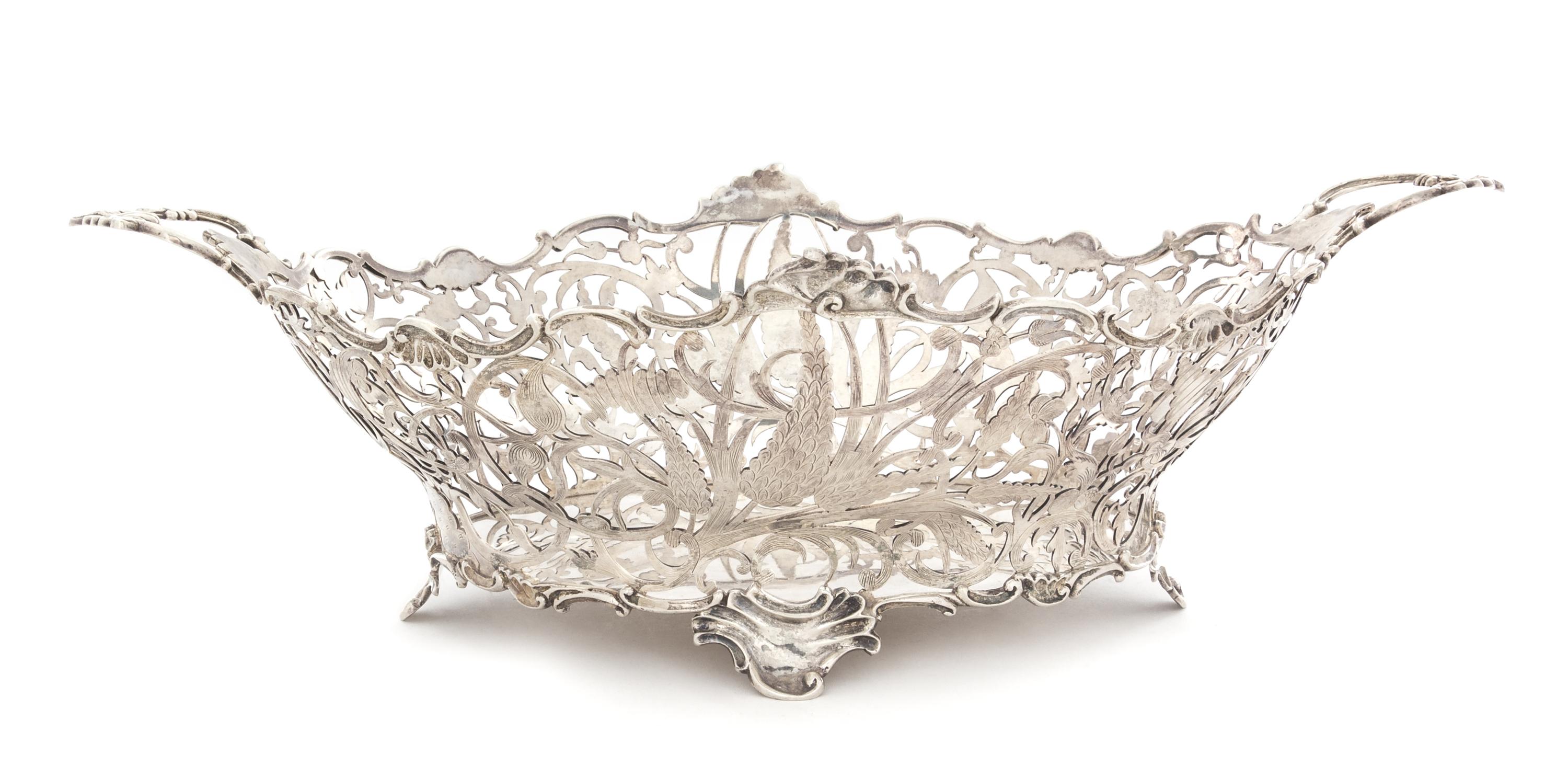 A Dutch Silver Center Basket, Likely Gerrit Duyzer, The Hague, Early 19th Century, the openwork body having floral, foliate and C-scrol