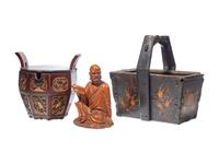 A Chinese Carved Boxwood Seated Immortal and Two Chinese Lacquered Wood Baskets