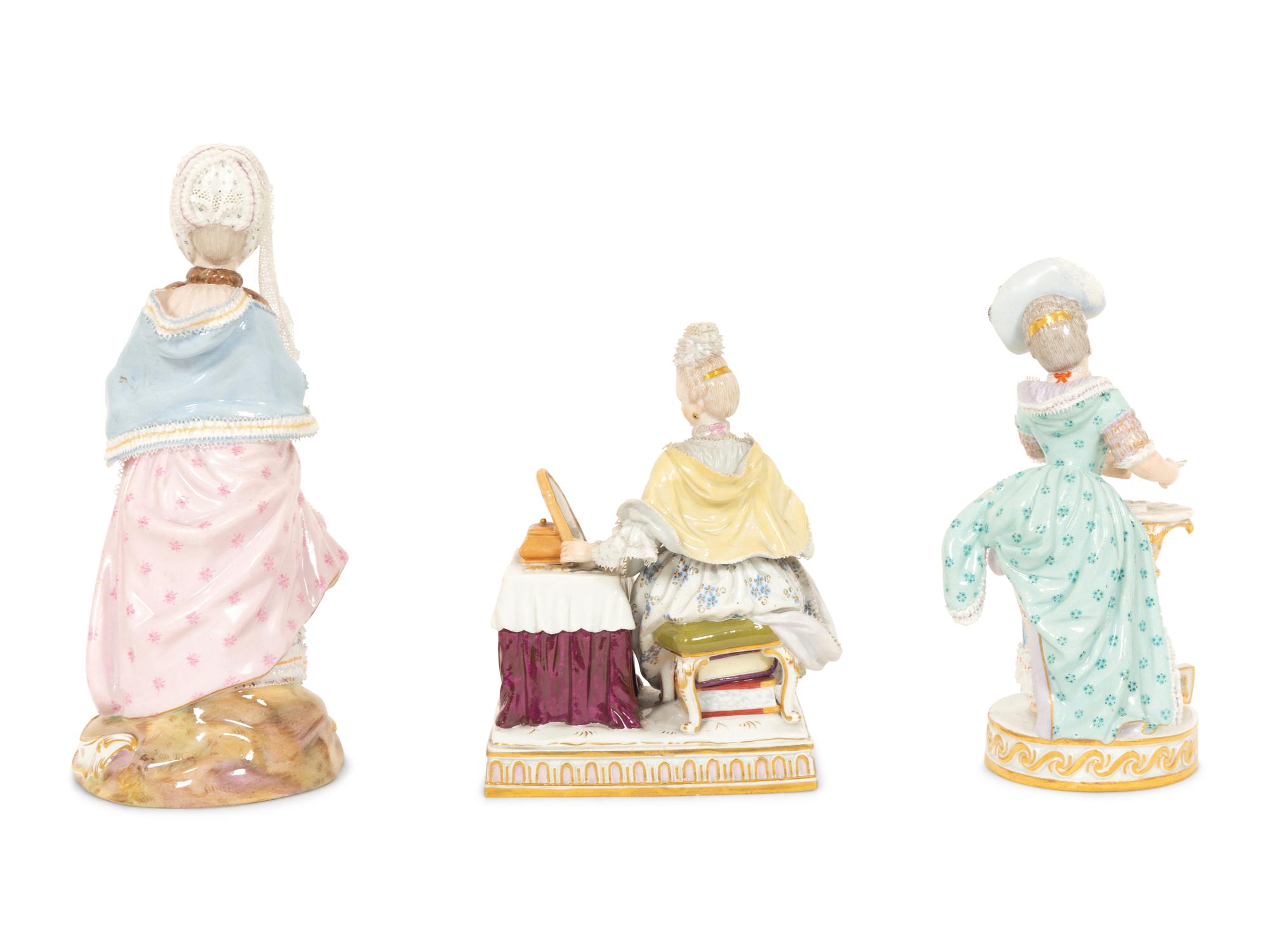 Three Meissen Porcelain Figures of Ladies in Lacy Dresses