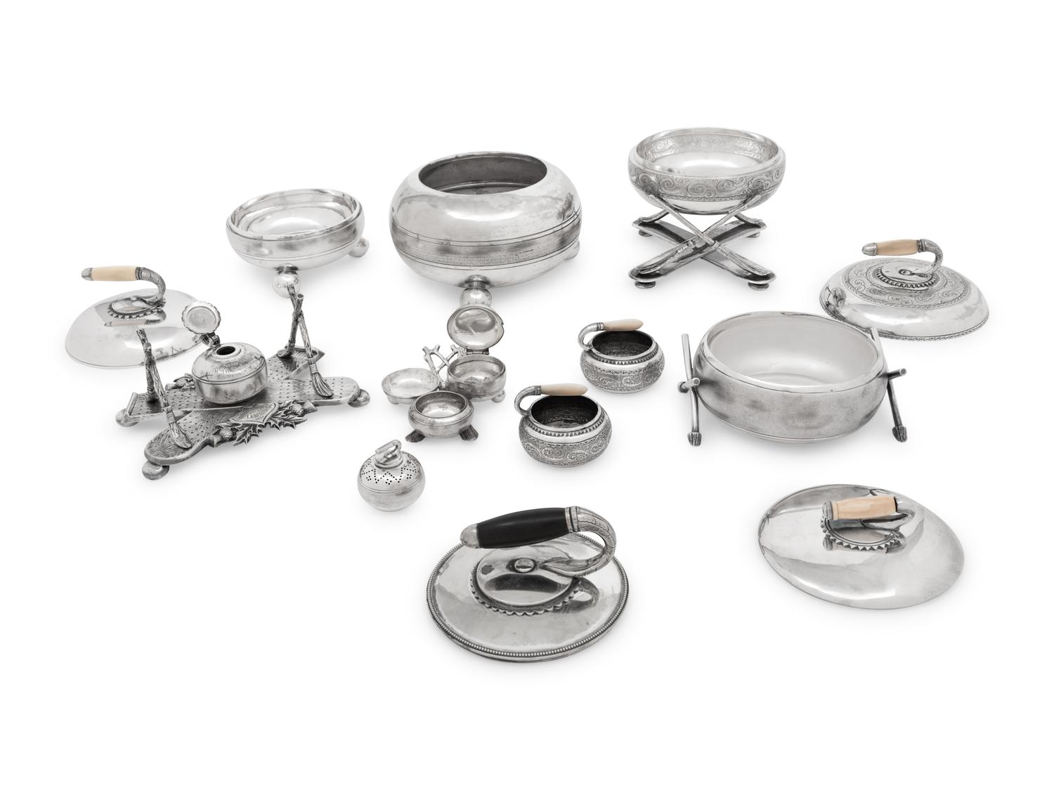 A Group of Eight Curling Stone-Form Silver-Plate Table Articles