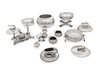 A Group of Eight Curling Stone-Form Silver-Plate Table Articles