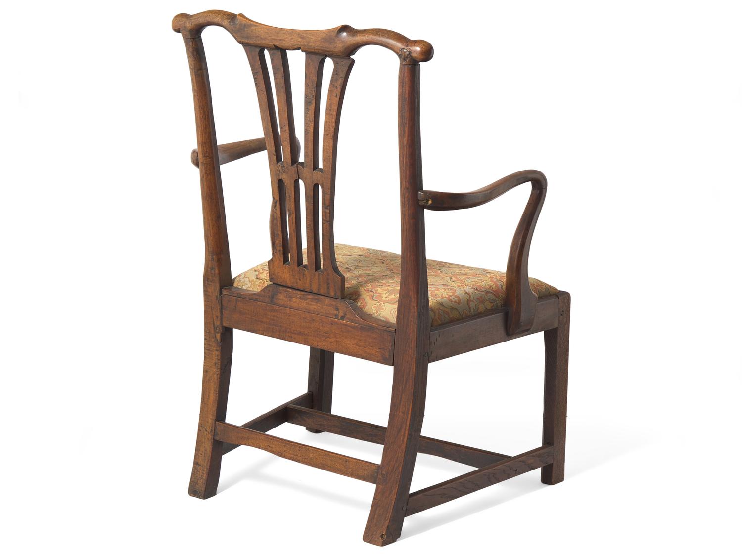 A Chippendale Carved Walnut and Elm Armchair