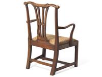 A Chippendale Carved Walnut and Elm Armchair