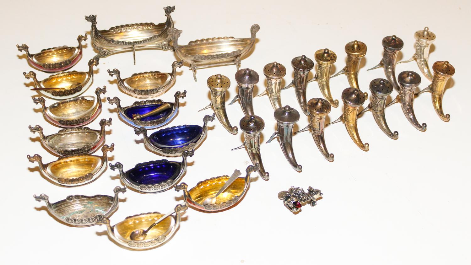 A Set of Silver Salts and Castors Height of tallest 2 1/2 inches.