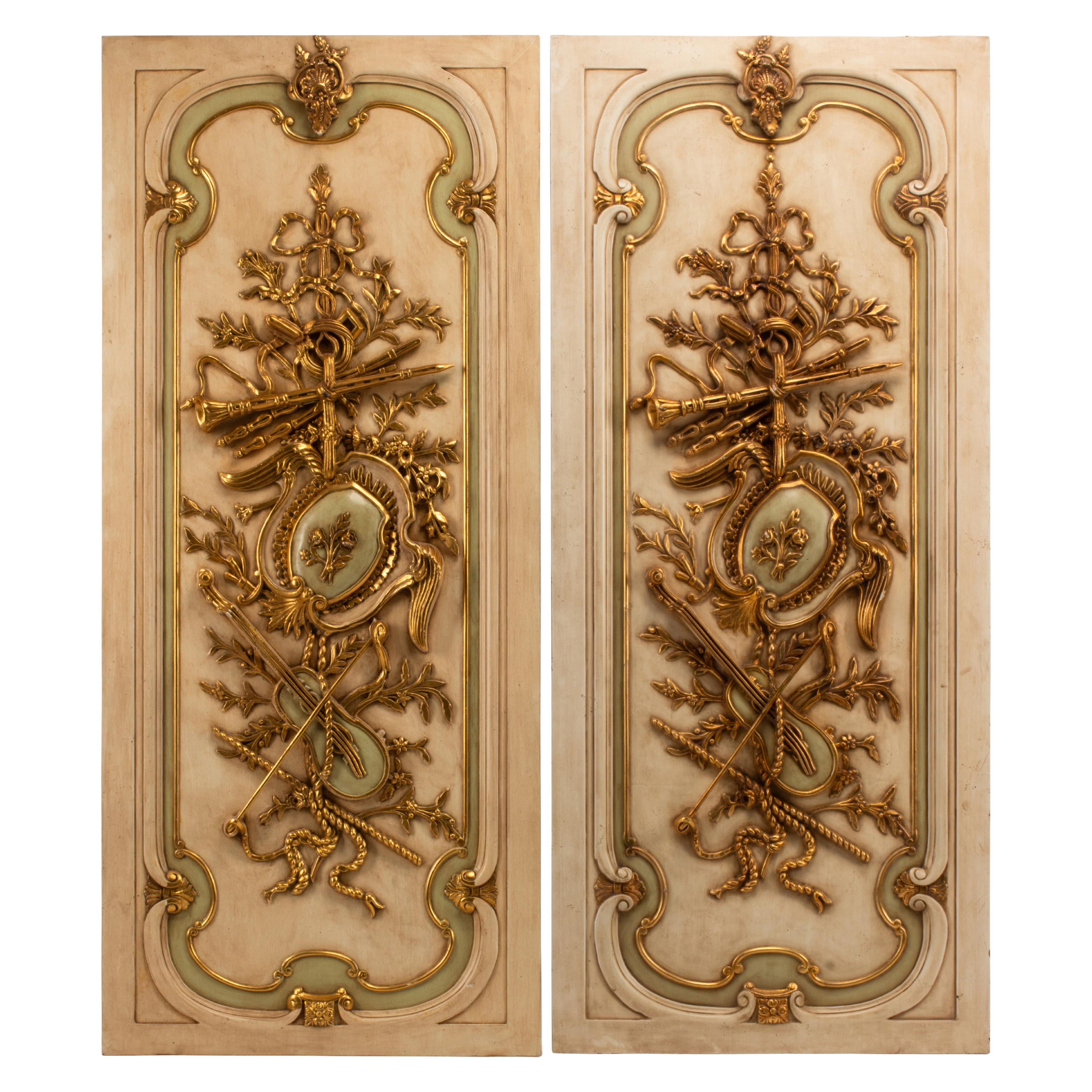 A Set of Four French Neoclassical Style Painted and Parcel Gilt Panels