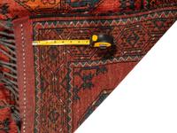 A Persian Wool Rug and Moroccan Saddle Mat