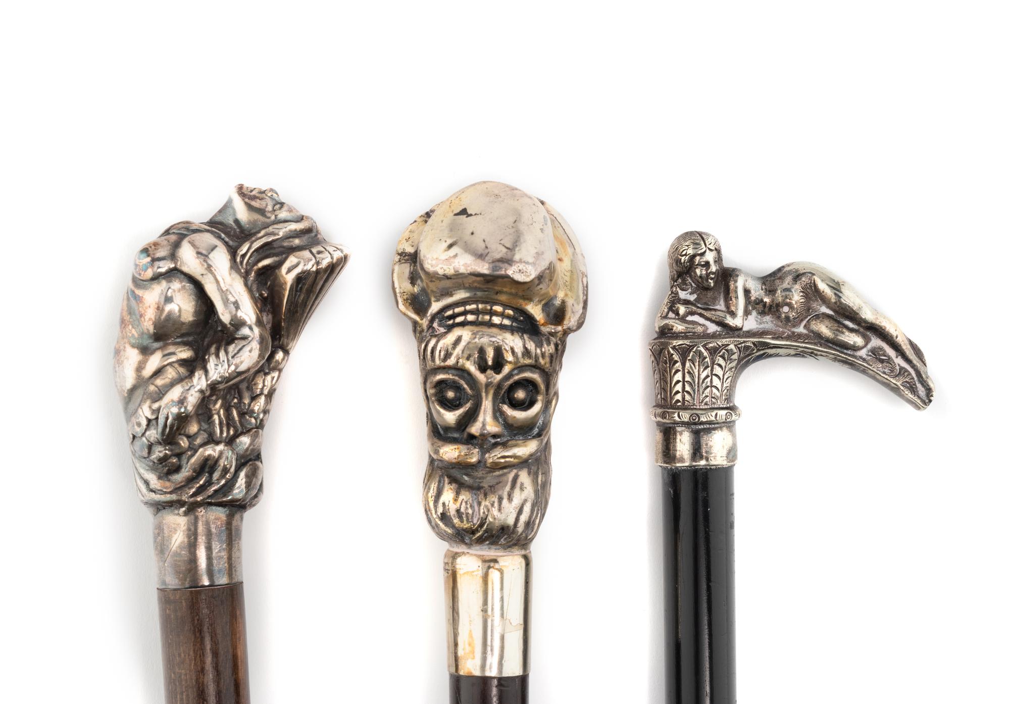 A Group of Three Silver Mounted Figural Walking Sticks