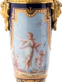 A Pair of Sèvres Style Gilt Bronze Mounted Painted, Parcel Gilt and "Jeweled" Porcelain Urns